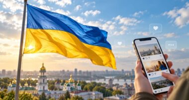 Прапор і смартфон над Києвом